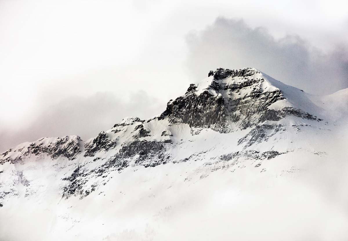 mountain range glacier mountain under white sky outdoors